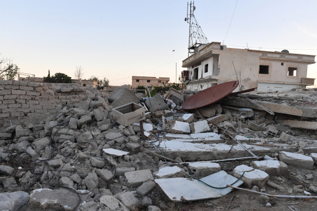 Здания, разрушенные в результате обстрелов в пригороде Дамаска Восточная Гута.